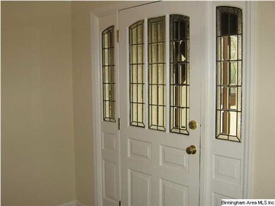 The front door with leaded glass is so welcoming.
