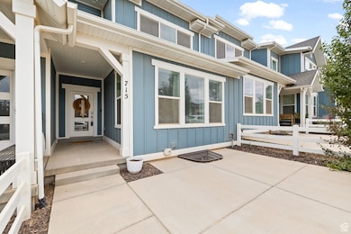 View of exterior entry featuring board and batten siding