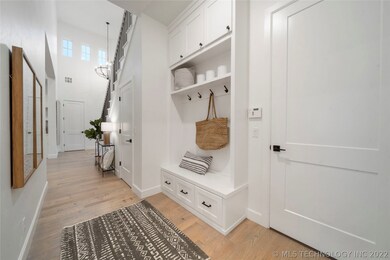 Coat closet in the Entry & a hallway leads to cubb