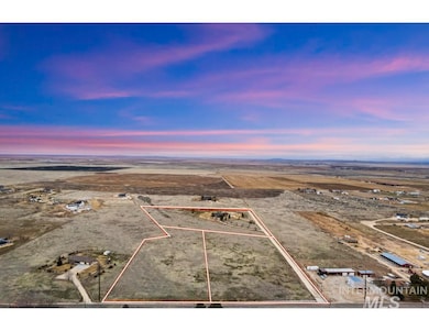 Aerial view at dusk of property boundaries highlighted, a view of countryside, and view of desert landscape