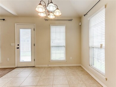 Casual dining rom with door to backyard