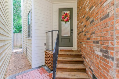 Follow the stone paver path to a freshly refinishe