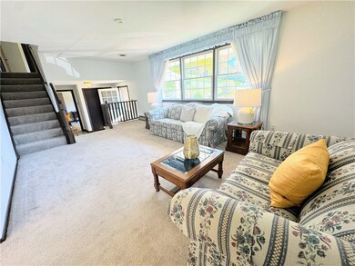 Large living area w triple south facing windows