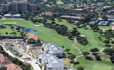 Aerial view with a water view and golf course view