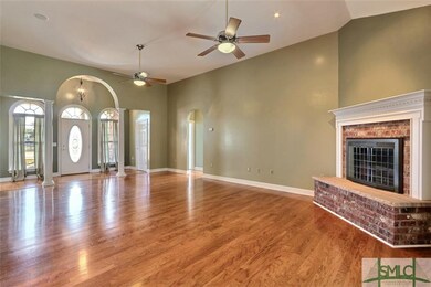 Arched foyer entrance to family room
