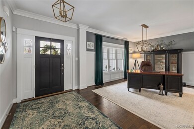 Entrance foyer with dark hardwood / wood-style flo