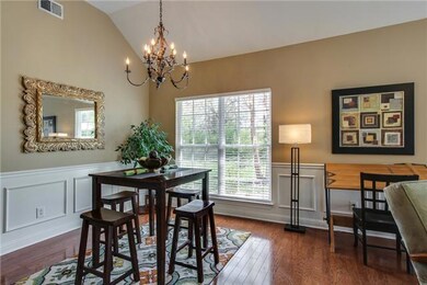 A New Chandelier & Wood Molding Around the Dining Room Bring Elegance and Style Creating a Beautiful Separate Area for Your Family to Enjoy.