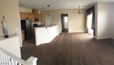 Kitchen featuring stainless steel appliances, dark