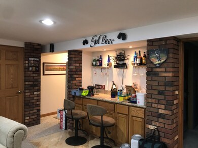 Wet bar in lower level and exterior entry thru gar