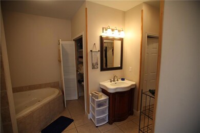 Master bathroom has large jacuzzi tub and separate