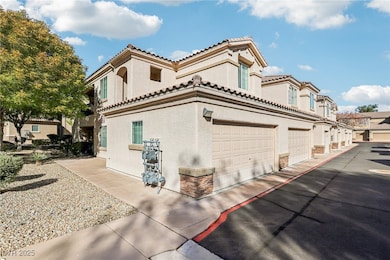 View of home's exterior with stucco siding and a tile roof