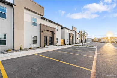 Uncovered parking lot featuring a residential view