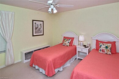 Bedroom featuring ceiling fan and light carpet