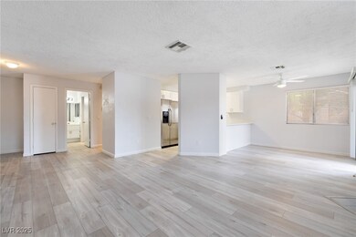 Unfurnished living room with a textured ceiling, a