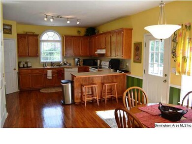 Huge eat-in kitchen with lots of sunlight, hardwoo