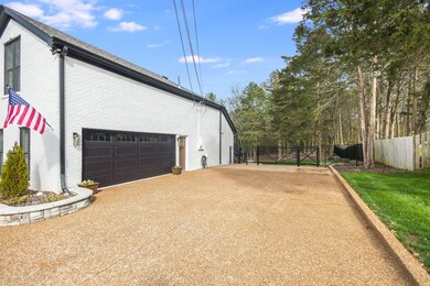 Gated entry to back yard from driveway
