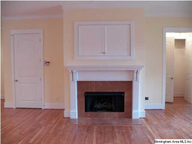 tile surround, built in T.V. cabinet over fireplac