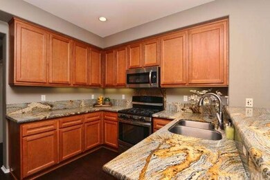 Kitchen with gorgeous granite counters and stainle