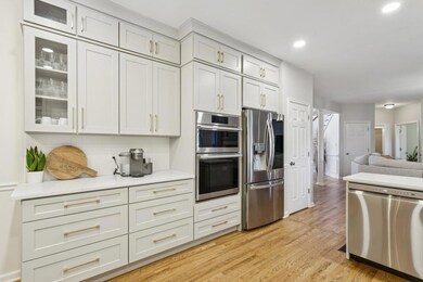 The Updated Chef's Kitchen is a Showstopper featuring Shaker Dove Soft-Close Cabinets, High-End Stainless Steel Appliances, Quartz Countertops, and Brass Finishes.