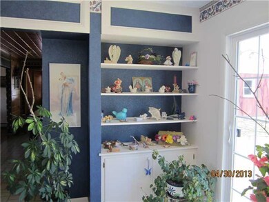 Living Room. Built in shelving and...