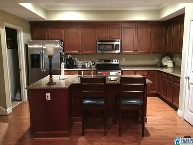 granite, stainless, lots of cabinets