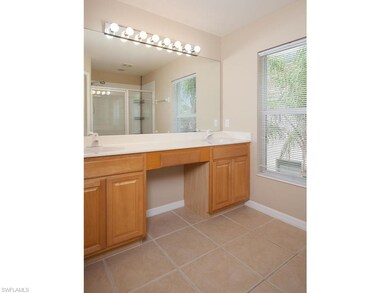 Master bathroom with dual vanities. Shower can be seen in mirror's reflection.