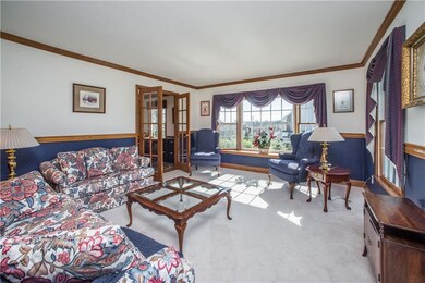 The formal Living Room is flooded by natural light