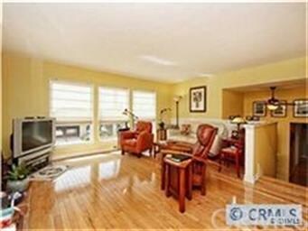 Living room windows, peak views of ocean