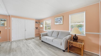 Living room featuring wood finished floors and wooden walls