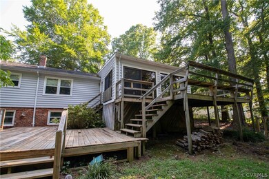 Back of house featuring a deck