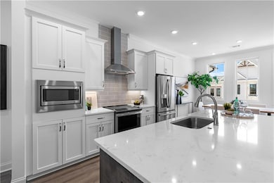 Gorgeous quartz counter tops and stainless appliances.