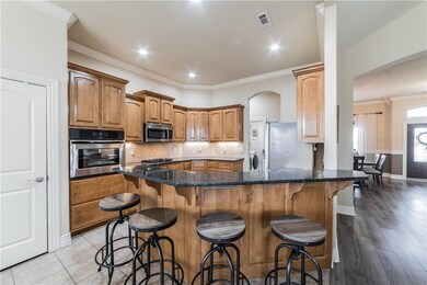 Kitchen boasts large pantry, new granite and extra seating