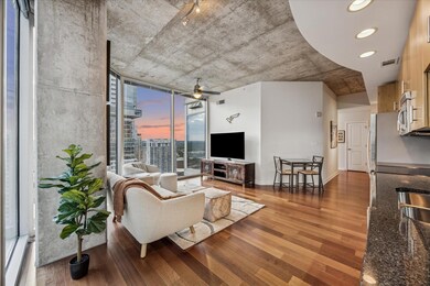 Living area with light wood-type flooring and flo
