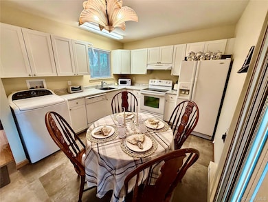 Kitchen featuring new cabinets, countertops and tile floor