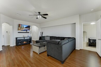 Living room featuring a fireplace, wood finished 