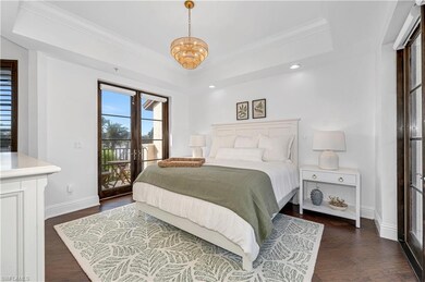 Bedroom featuring a raised ceiling, access to exte