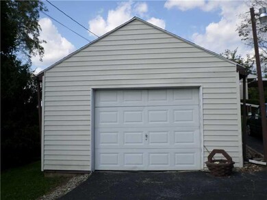 Parking Lot/Garage. Detached garage with blacktop 