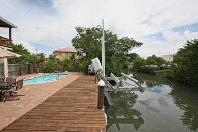 Dock, pool, boat lift, canal to north