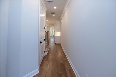 Corridor featuring recessed lighting, visible vent