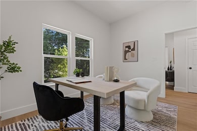 Office featuring light wood-style flooring and baseboards