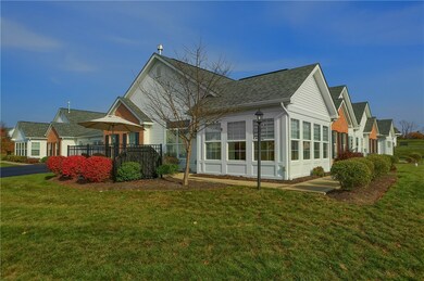 Clean landscaping adds great curb appeal to this h