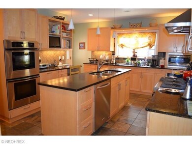 Wonderful updated kitchen with maple cabinets, bla
