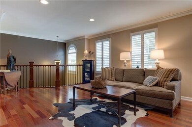 Family room showcases a spectacular wrought iron a