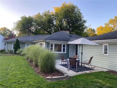 Rear view of house featuring a patio area and a ya