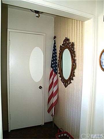 Entry way with cloak closet by front door.