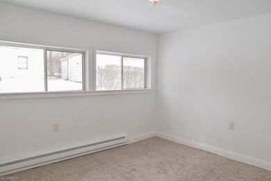 Master bedroom in the back of the house with a lar