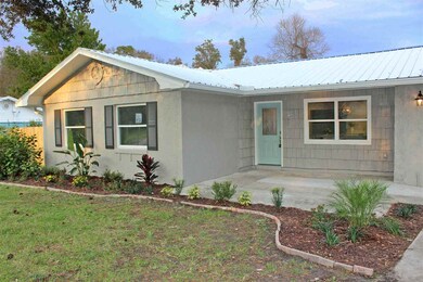 New windows, gutters with downspouts, new interior