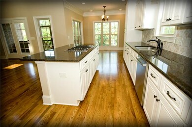Impressive birch glazed cabinetry and granite coun