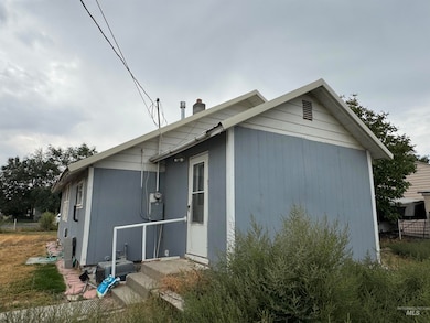 View of side of home featuring a chimney