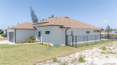 View of side of property with stucco siding, roof